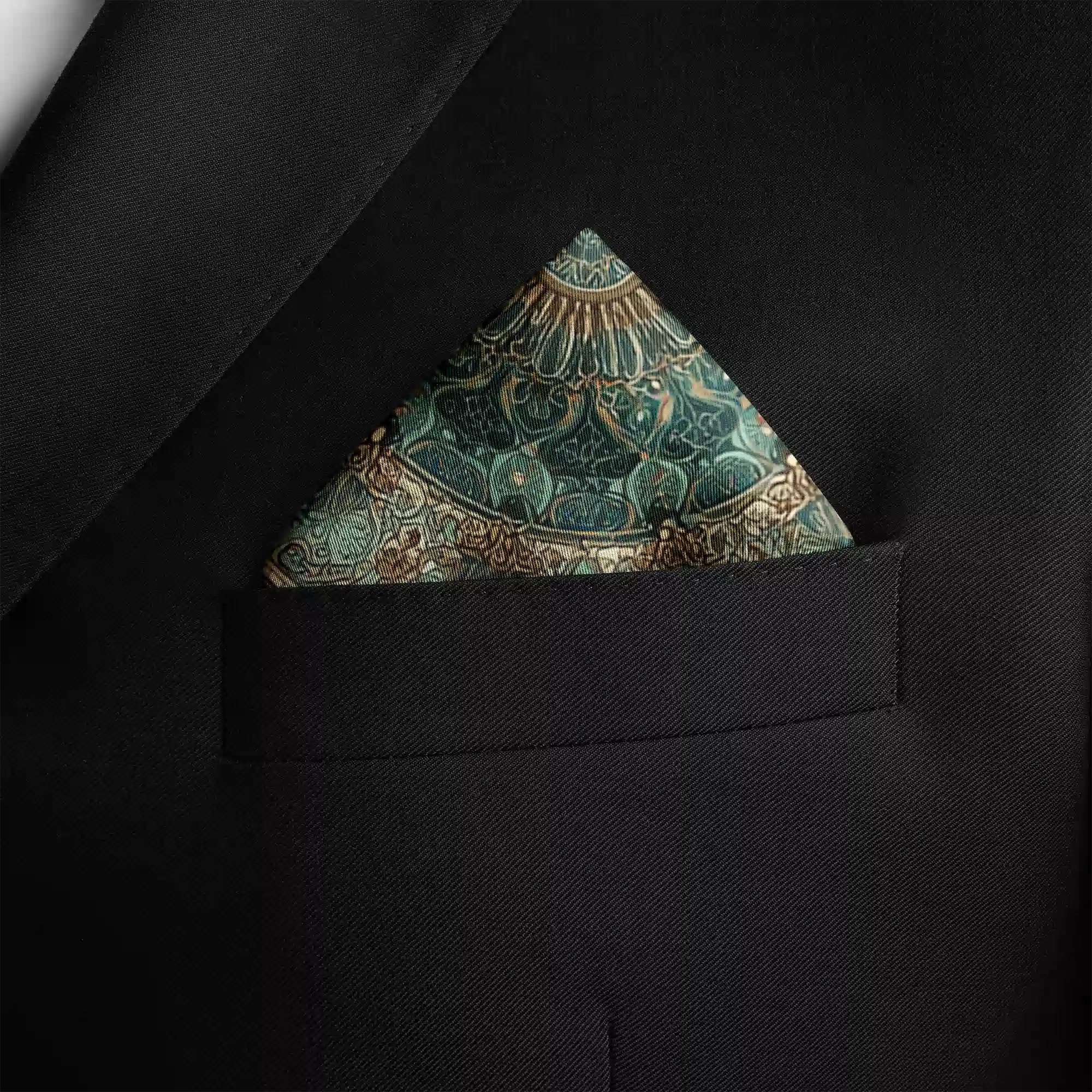 Sophisticated pocket square in teal, sage green, and muted gold, featuring an intricate mandala centerpiece surrounded by delicate birds and arabesque detailing—evoking balance, tradition, and artistry.